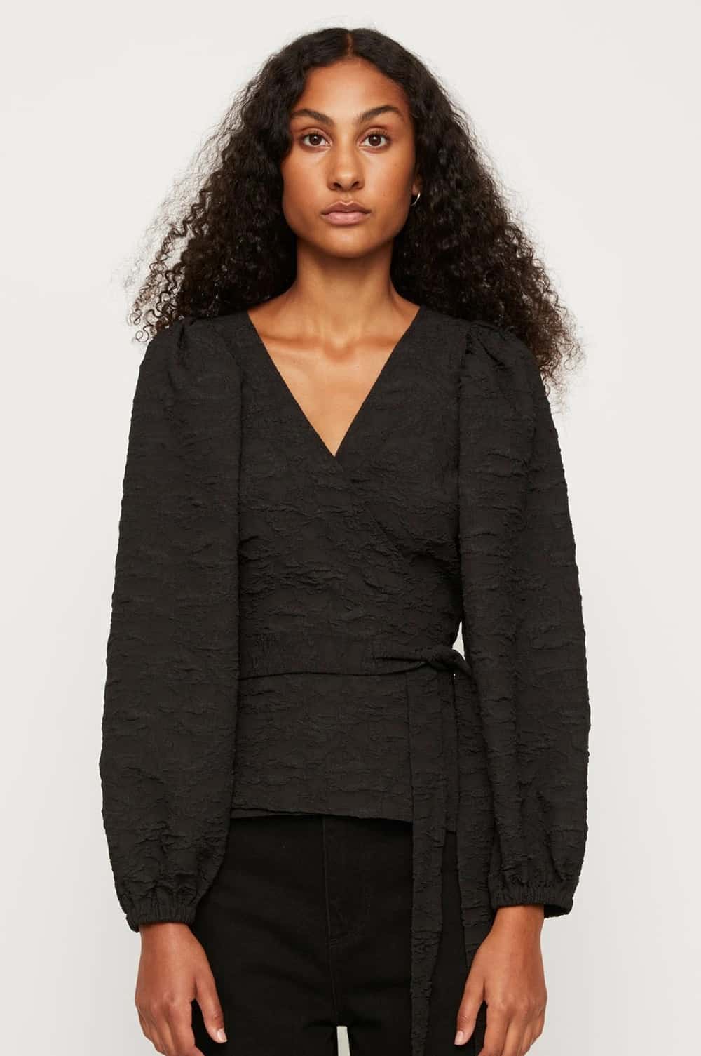 https://www.cocaranti.com/wp-content/uploads/2021/02/Just-Female-Toda-Wrap-Blouse-in-Black-Model-Front.jpg